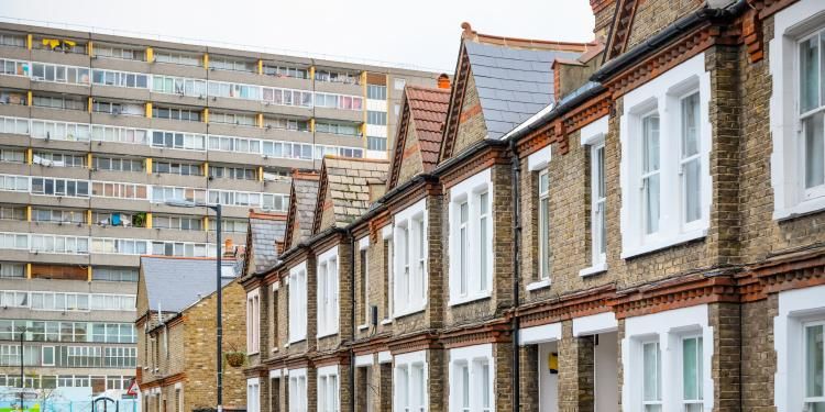 Terraced housing with council housing blocks in the background