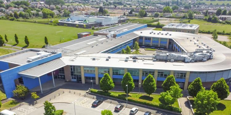 Aerial shot of Abbey Multi Academy Trust building with green areas surrounding the building. 