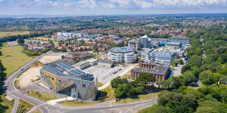 Aerial photo of the Bournemouth University, Talbot Campus buildings from above showing the Arts University Bournemouth, the Student Village, Fusion Building, Medical Centre See Less By Duncan