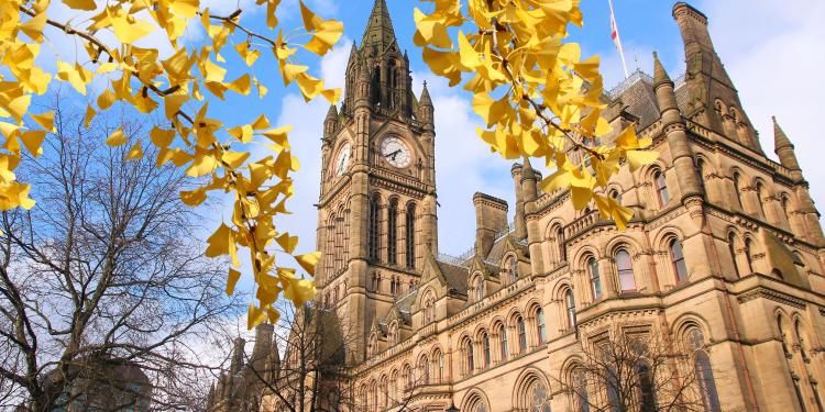 Manchester city hall with autumn leaves
