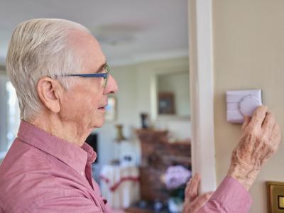 man with thermostat