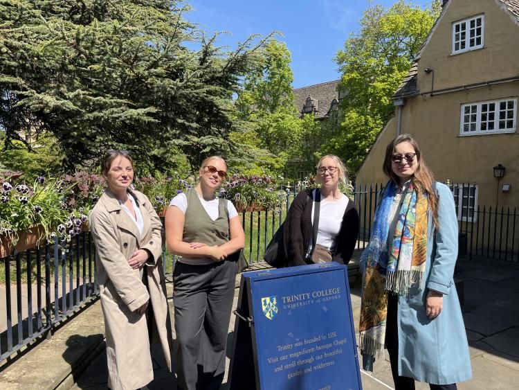Trinity - group pic with sign.