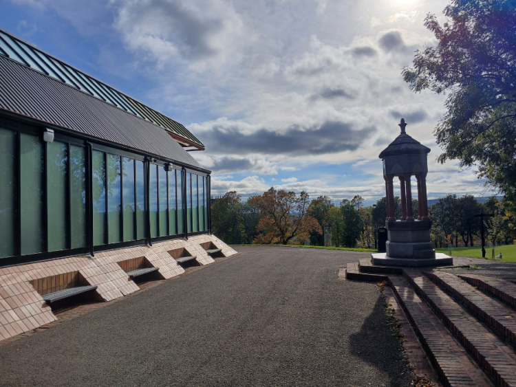 Looking along the outside of Elswick Swimming Pool, which is in the middle of a large, green park.